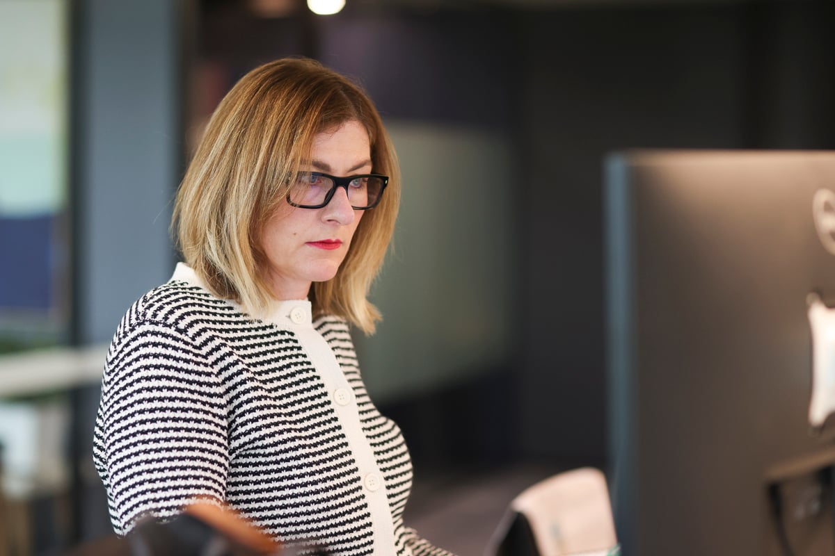 A Prime Partners accountant working at her desk