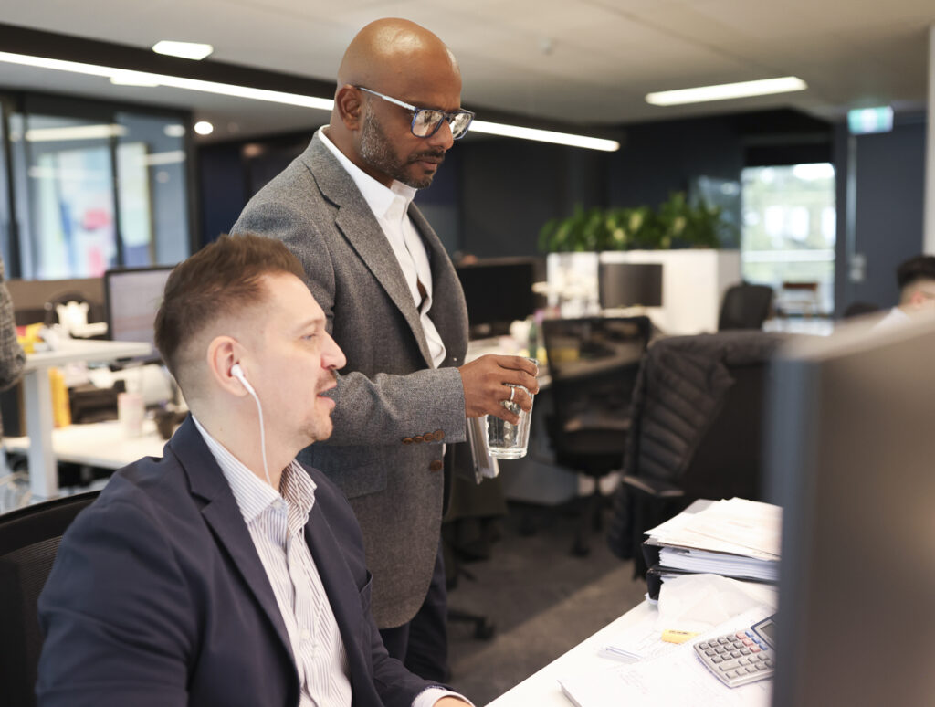 Prime Partners Director Jules Koralage working with Associate Director Vlad Sixta on payroll, cash flow and Payday Super readiness.